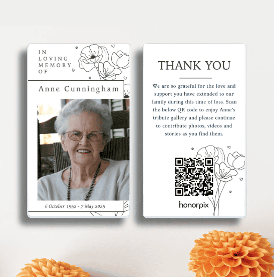 Memorial card with photo, QR code, and floral illustrations for Anne Cunningham.