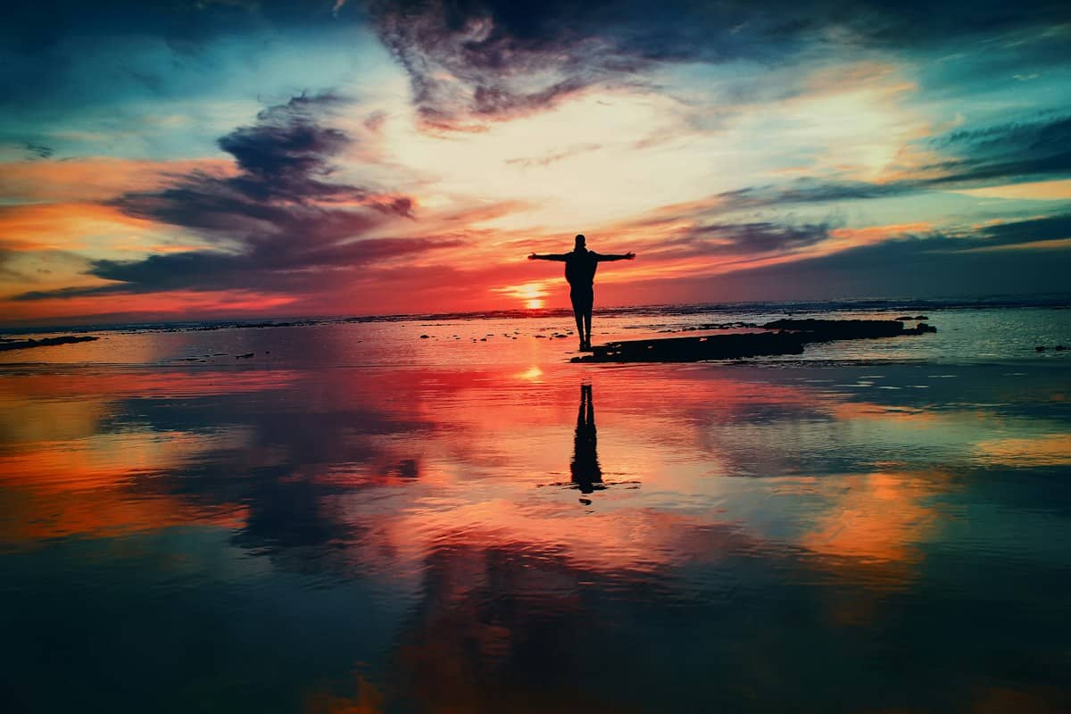 Serene golden sunset over calm waters representing peace and remembrance